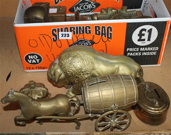 12 brass money boxes and a brass bull